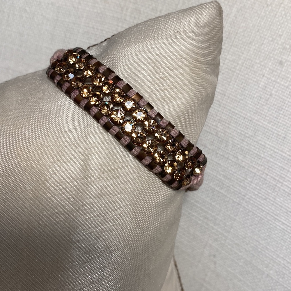 Crystal bracelet. Gold crystals on adjustable macrame violet string.